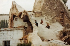 Turkish boys play on the roof of their house near Gorem in the caves of Cappadocia, Turkey, 1992